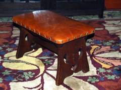 Original Limbert footstool with cut out design in original finish signed by brand